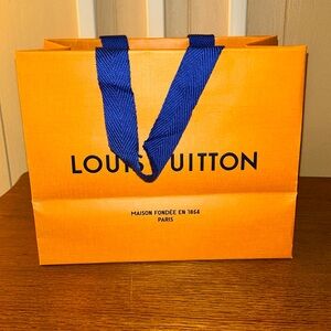 Small LV shopping bag.